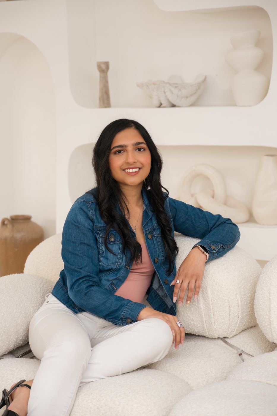 Simran Puri, counselor, seated in her studio
