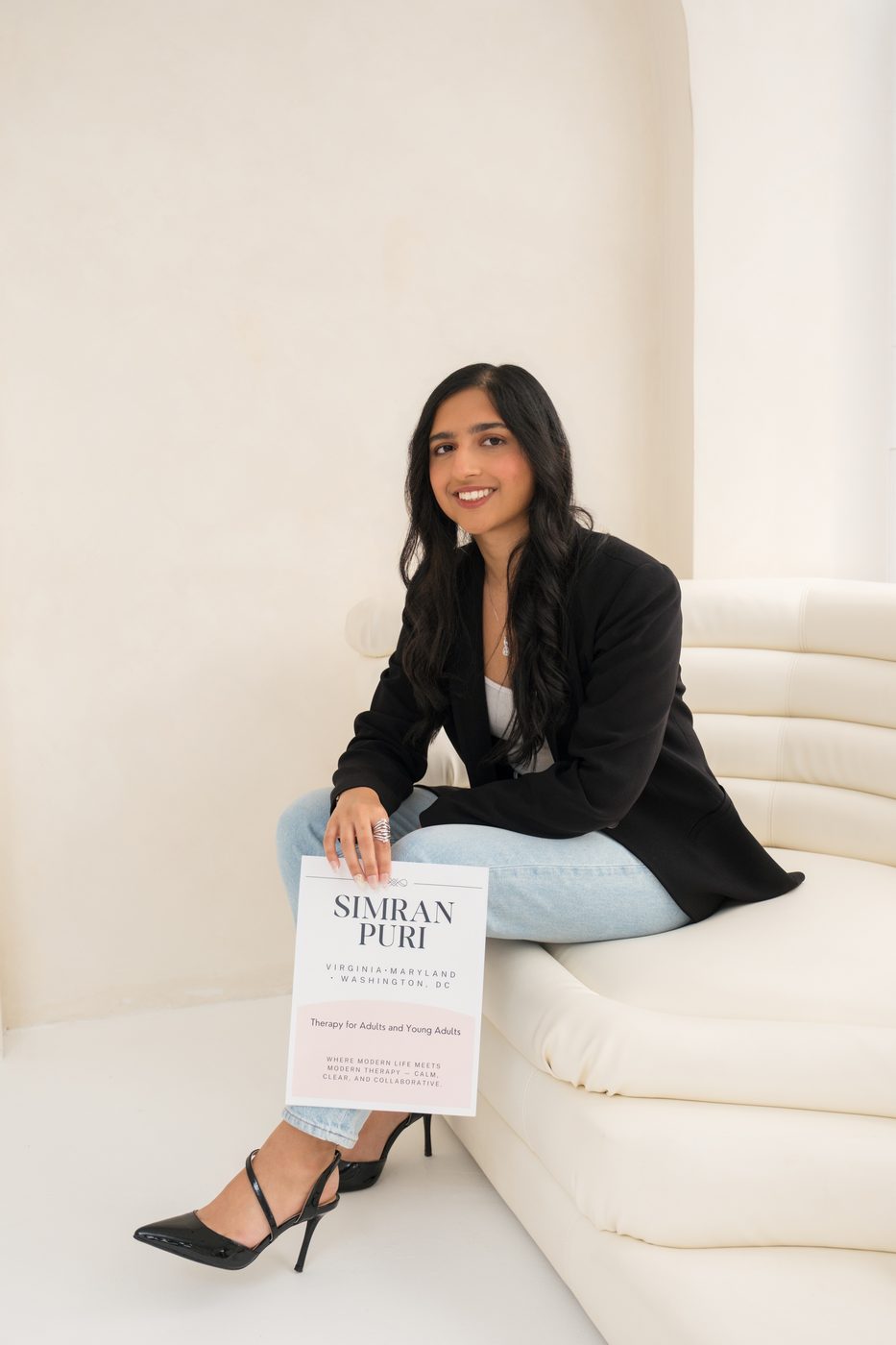 Simran Puri holding her practice brochure